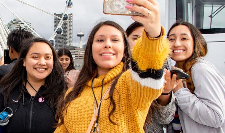 students take a group selfie